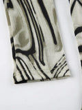 Cutout Irregular Print Slanted Hem Long Sleeve Knit - HouseofHalley
